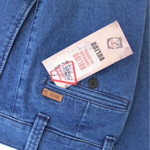 a pair of tickets in a pocket of a blue jean